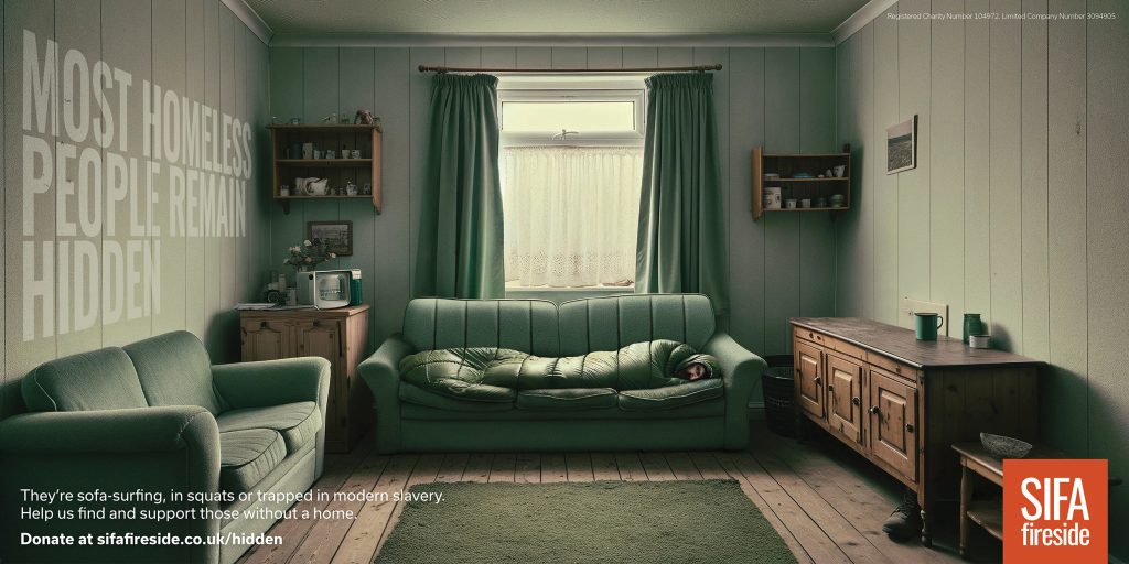 Poster for homeless charity SIFA that shows a man asleep on a green sofa in a house . His sleeping bag blends in to the pattern of the sofa so you don't see him at first. Headline reads Most Homeless People Remain Hidden.